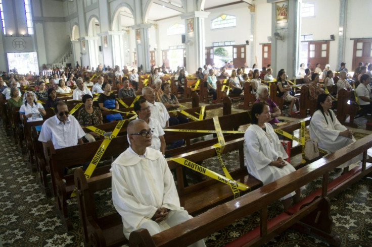 A Catholic church in the central Philippines held its Sunday service with worshippers separated by barricade tape