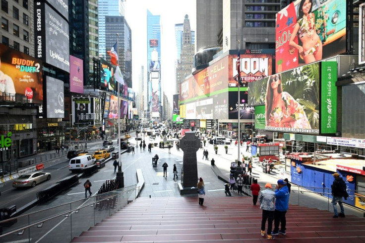 Few people are seen at Times Square in Manhattan on March 16, 2020  in New York City