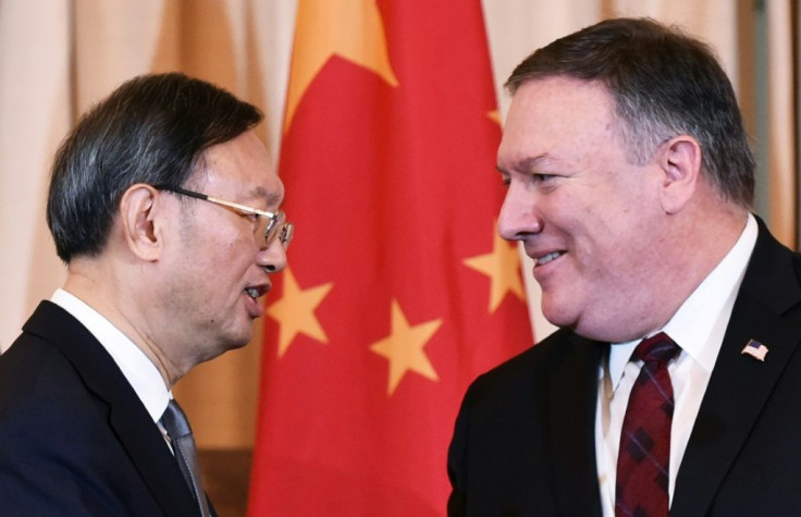 US Secretary of State Mike Pompeo and Chinese politburo member Yang Jiechi shake hands following a press conference in Washington in November 2018