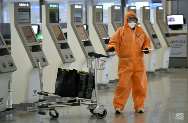 A passenger at Incheon airport near Seoul in South Korea comes prepared for COVID-19