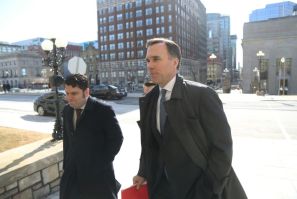 Canada's Finance Minister Bill Morneau (R) arrives at parliament for a news conference to detail emergency funding measures to help Canadians and businesses weather the coronavirus pandemic