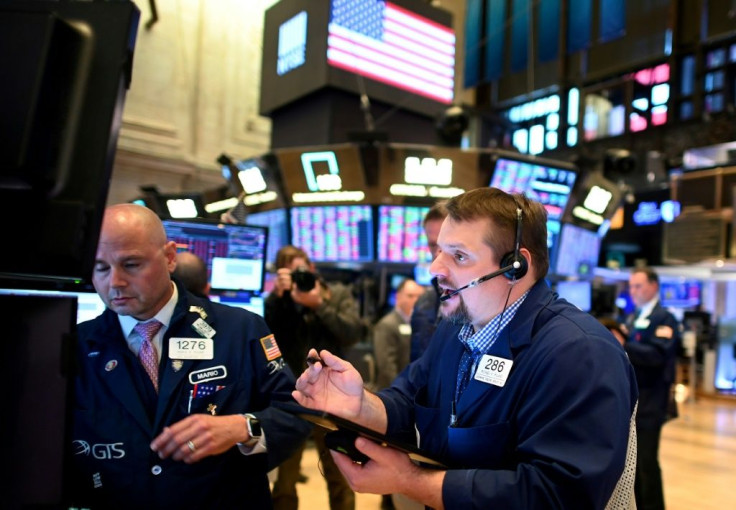 Traders at the New York Stock Exchange, which announced all activity will be shifted to electronic platforms starting Monday due to the coronavirus
