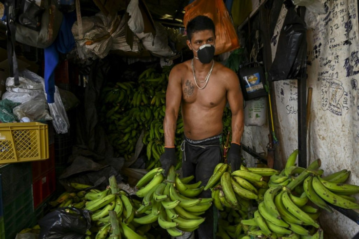 A man works at a market in Medellin, Colombia, on March 19, 2020