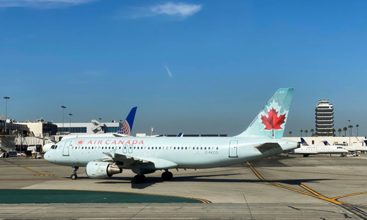 Air Canada is planning temporary layoffs of roughly half its 10,000 flight attendants, their union says