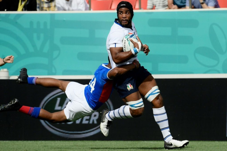 Maxime Mbanda, being tackled by Namibia's Chad Plato at the World Cup, is accustomed to a battle