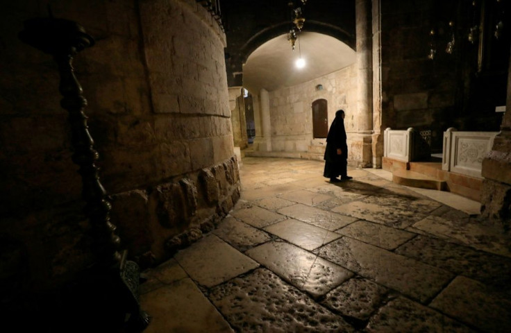 A nun walks along a deserted corridor in the Church of the Holy Sepulchre, believed by Christians to be the burial site of Jesus Christ