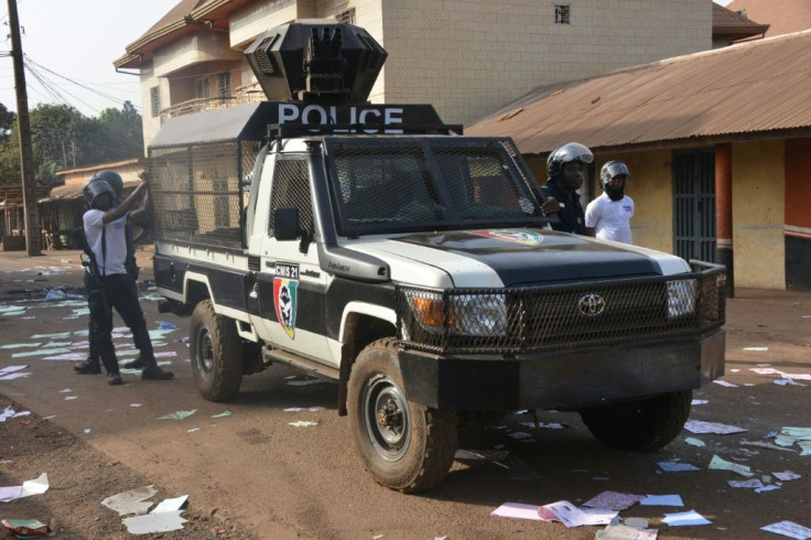 Guinean police officers guarded voting stations where protesters destroyed ballot papers