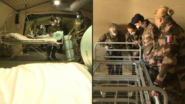 IMAGES French soldiers work hard to set up an army field hospital in the car park of the Mulhouse hospital centre. The facility is expected to accommodate 30 beds for coronavirus patients, and should be operational by the middle of the week. (TO COMPLETE 
