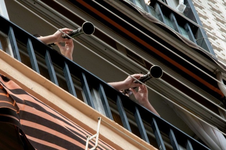 In Spain people play music from their balconies after strict lockdown measures were brought in to battle the spread of the coronavirus