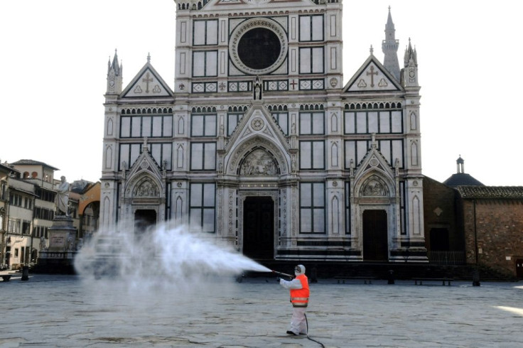 A municipal worker disinfects the Piazza Santa Croce in Florence as part of the measures taken by the Italian government to fight the spread of the COVID-19