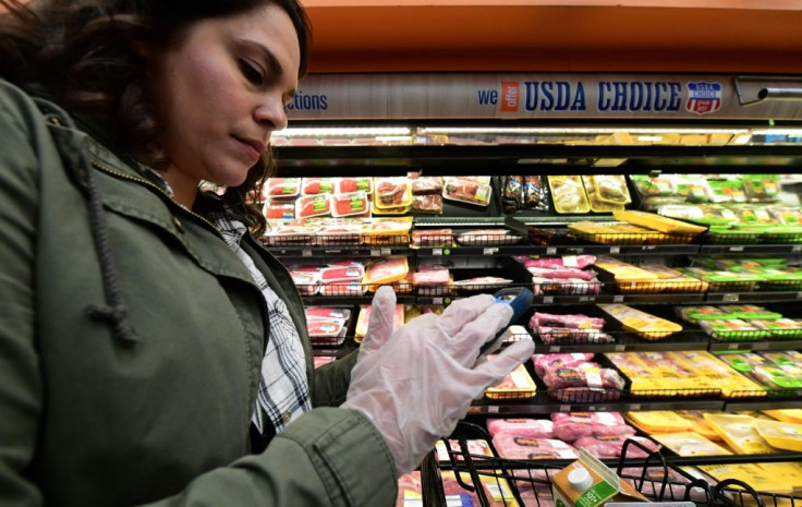 Instacart will be hiring some 300,000 additional shoppers for its grocery delivery service; in this picture Instacart shopper Monica Ortega is seen at a supermarket in North Hollywood, California on March 19, 2020