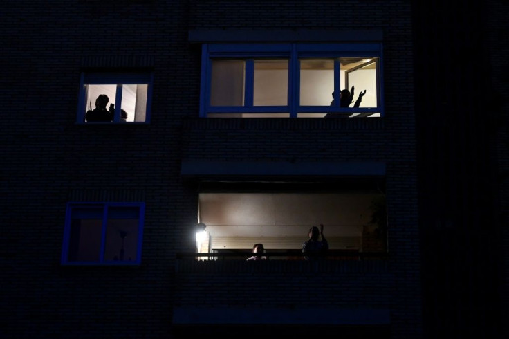 Inhabitants applaud to pay tribute to medical staff in Madrid during a national lockdown