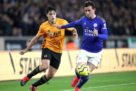 Raul Jimenez of Wolverhampton Wanderers tackles Ben Chilwell of Leicester City