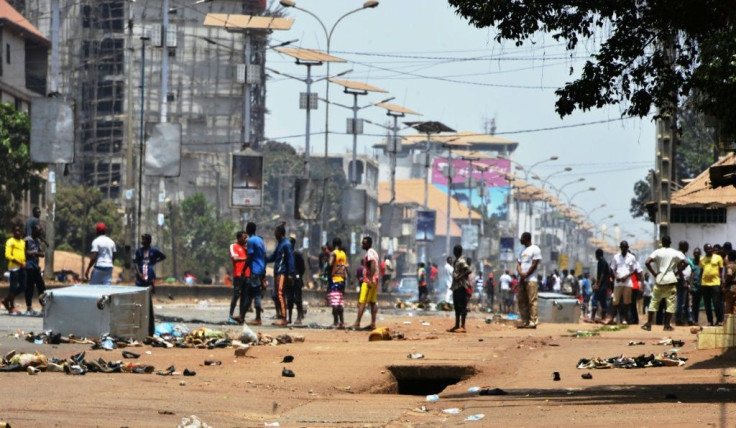 Protesters confront the Guinean army in the streets in Conakry on March 22, 2020, during a constitutional referendum in the country