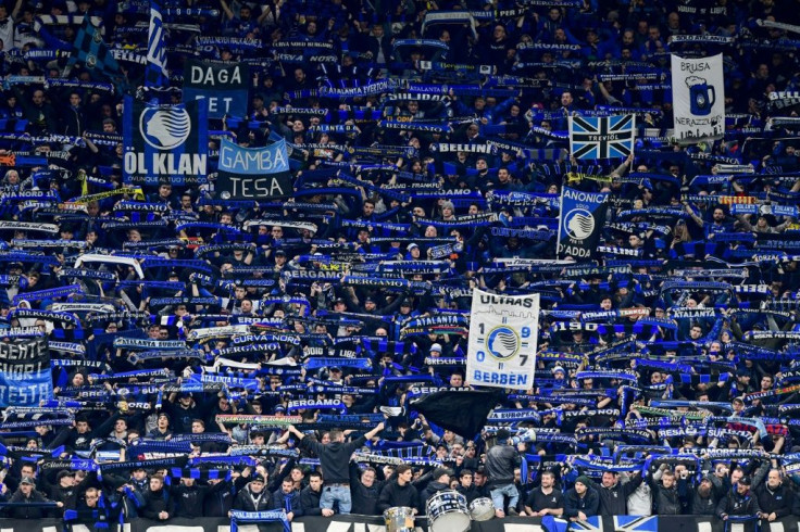 Atalanta fans cheer during the UEFA Champions League football match between against Valencia in Milan's San Siro Stadium on February 19.