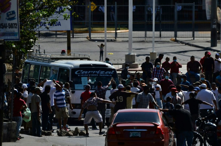 Hundreds of Hondurans took to the streets, demanding they be provided with food before the government-mandated curfew to curb the spread of the coronavirus went into effect