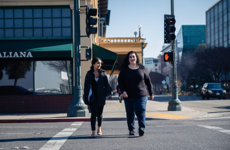 Lorrine Paradela, right, a 45-year-old single mother is one Stockton resident receiving monthly cash as a 'universal basic income'