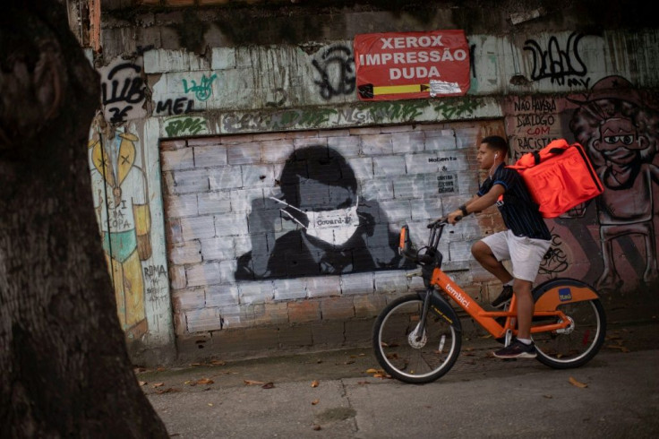Brazilian President Jair Bolsonaro wears a face mask in this informal mural, even though he has downplayed the severity of the COVID-19 pandemic