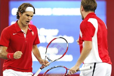 Way back when: Roger Federer and Stan Wawrinka celebrate after winning Olympic gold in the men's doubles in 2008 at Beijing