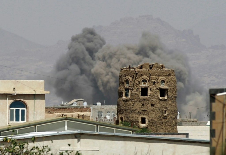 Smoke billows from buildings after reported air strikes in 2025 by the Saudi-led coalition on arms warehouses at an airbase controlled by Huthi rebels