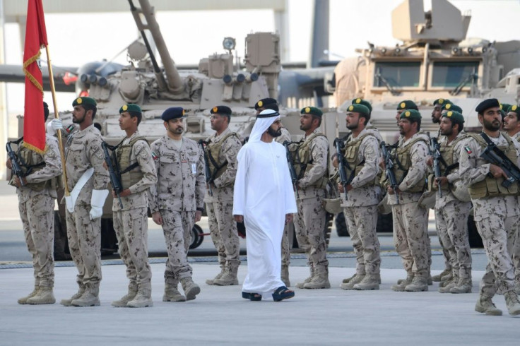 Sheikh Mohamed bin Rashid al-Maktoum, Vice President and Prime Minister of the United Arab Emirates, in February walks past military personnel who served in Yemen