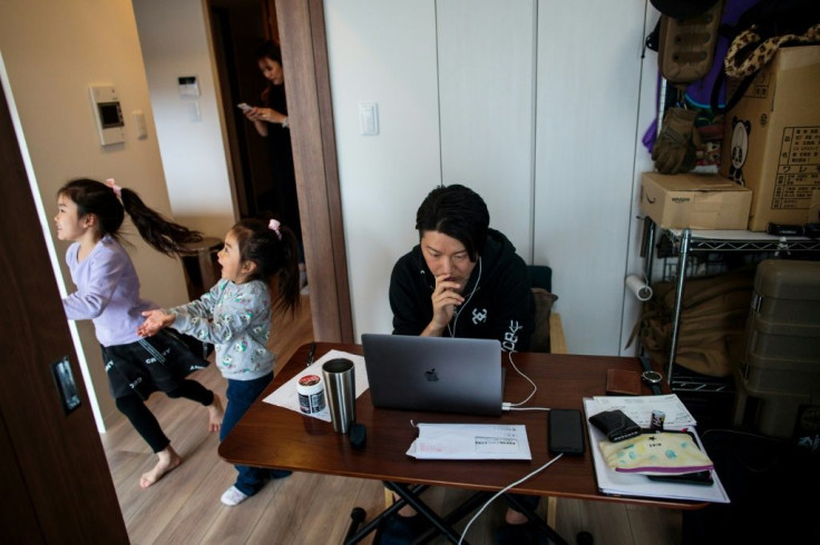 Working at home Yuki Sato, an employee of a startup company