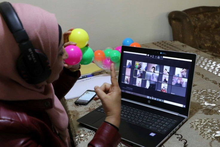 Palestinian teacher Jihad Abu Sharar conducts an online class from her home in the occupied West Bank