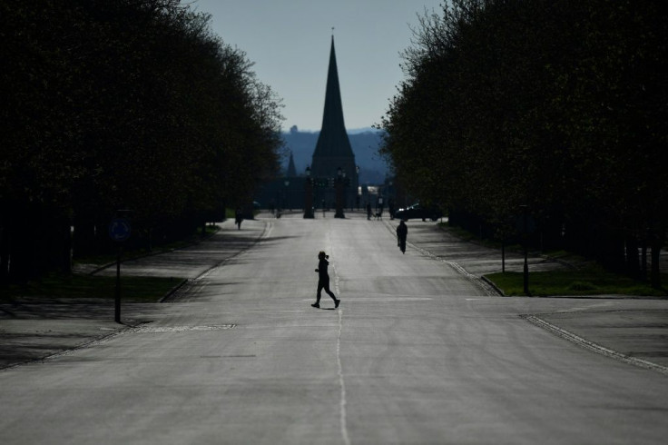 A runner exercises in Greenwich Park in south London