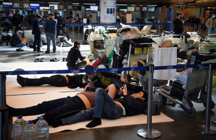 Travellers wait for flights to get back home at Moscow's Vnukovo airport