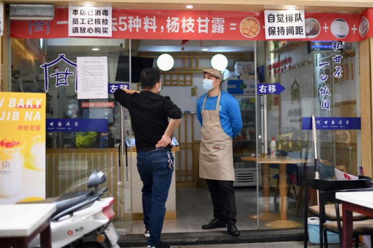 Restaurants in Huanggang have re-opened but diners aren't allowed to eat inside, and are served at outdoor tables instead