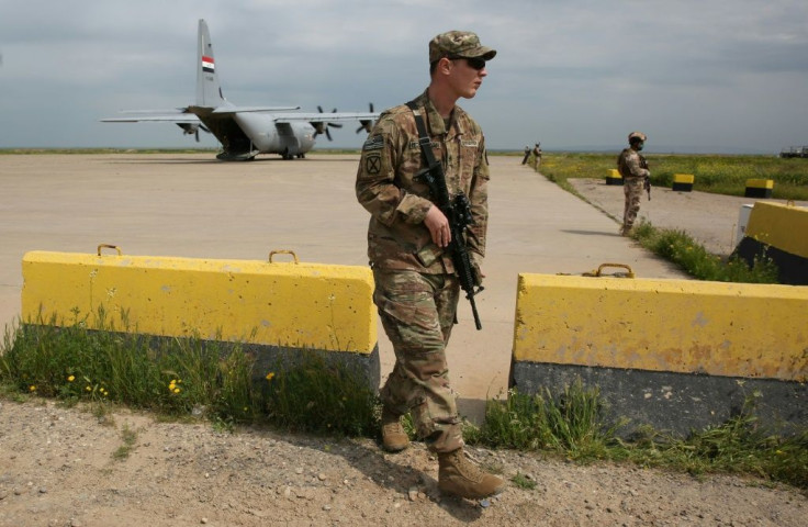 An American soldier walks at the Qayyarah air base ahead of a planned pullout by US-led forces