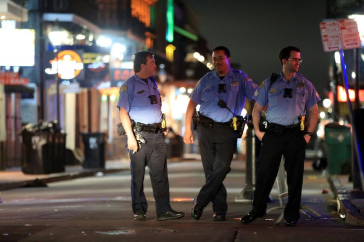 New Orleans police officers patrol an empty Bourbon Street after Louisiana Governor John Bel Edwards ordered the closure of all bars and restaurants because of the coronavirus outbreak