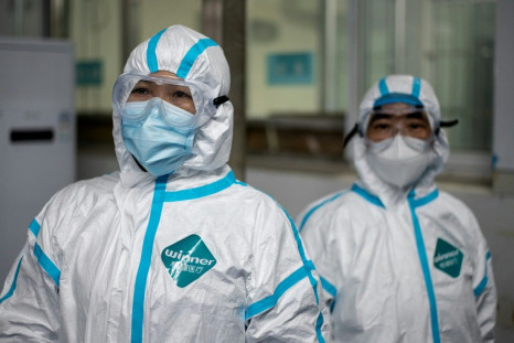 Medical workers wearing hazmat suits as prevention against the COVID-19 coronavirus at work at the Huanggang Zhongxin Hospital in Huanggang, in China's central Hubei province