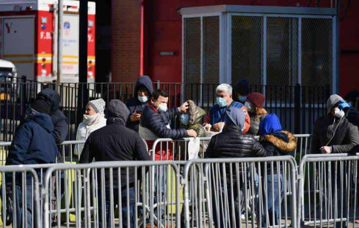 New Yorkers queue outside Elmhurst Hospital Center in Queens to get tested for the coronavirus