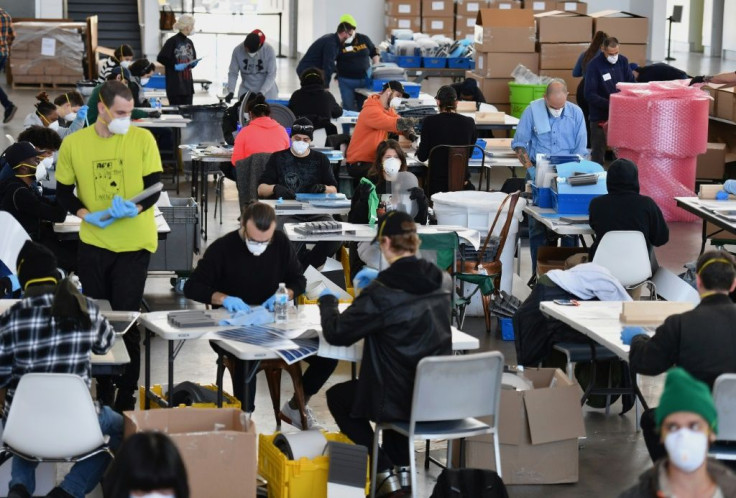 Workers manufacture personal equipment such as face shields at the Brooklyn Navy Yard to keep up with demand