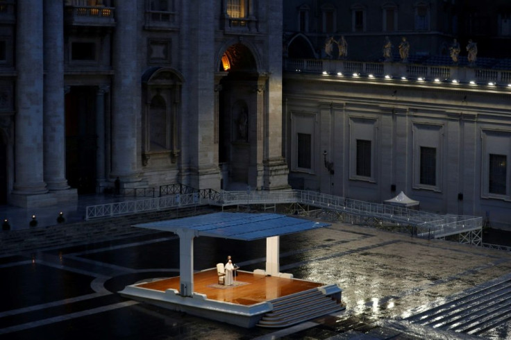 A general view shows Pope Francis (C) presiding over a moment of prayer in am empty St Peter's Square at the Vatican