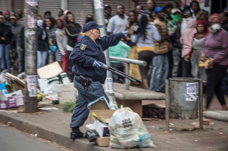 But many people queueing for food at stores ignored police efforts to get them to keep a safe distance from each other