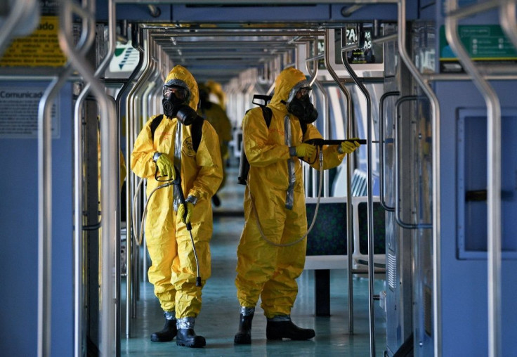 Brazilian soldiers disinfect a train wagon at the central station in Rio de Janeiro