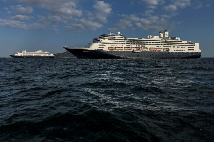 The cruise ships Zaandam (L) and the Rotterdam are seen in Panama City bay on March 28