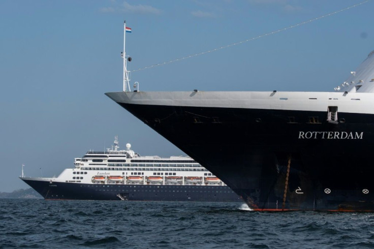 Holland America's cruise ship Zaandam (L) and the Rotterdam in Panama bay on March 28, 2020