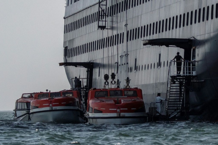 Passengers from Holland America's cruise ship Zaandam are transferred to the Rotterdam off Panama on Saturday