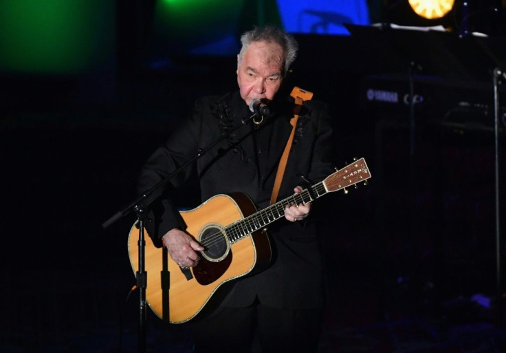 US singer-songwriter John Prine, pictured June 2019, has been hospitalized and intubated due to a "sudden onset of Covid-19 symptoms," according to his family