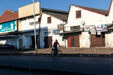 A lone cyclist makes his way in the usually bustling part of downtown Harare