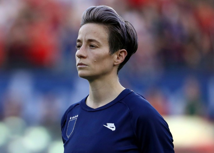 US star Megan Rapinoe wears her jersey inside-out to hide the US Soccer Federation logo during the national anthem before a SheBelieves Cup match against Japan in Frisco, Texas