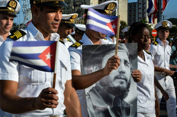 Members of the Navy display a picture of Cuban former president Fidel Castro during the May Day parade at Revolution Square in Havana, on May 1, 2016