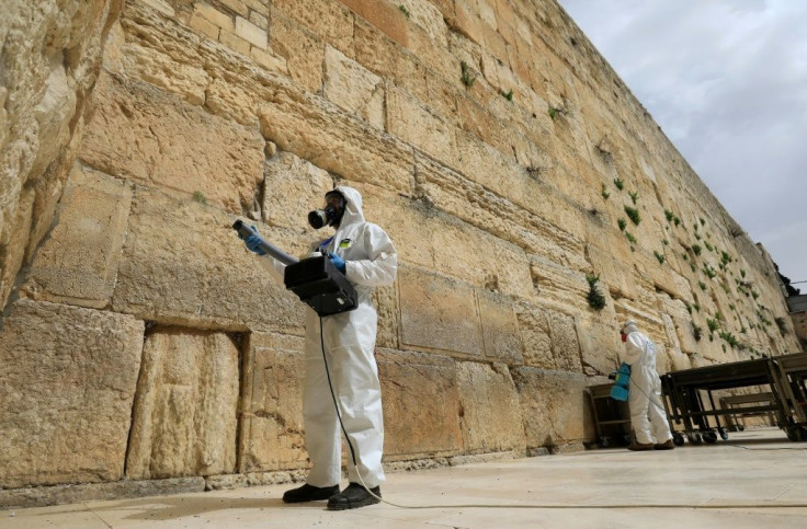 Workers sanitise the Western Wall, the most holy site where Jews can pray against the spread of the coronavirus COVID-19 in Jerusalem.