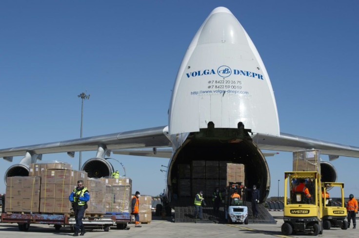 Boxes of masks flown in from China on a special flight being unloaded in France earlier this week to help alleviate a shortage of protective gear for health care workers