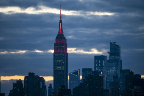 New York's Empire State Building is lit with a white and red 'siren' to pay tribute to medical workers battling the coronavirus