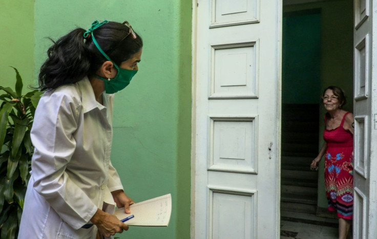 Cuban doctor Liz Caballero goes door-to-door in Havana on March 31 looking for possible cases of coronavirus