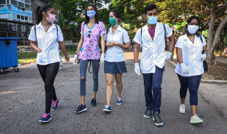 Medical students go door-to-door in Havana's Vedado neighborhood in search of potential coronavirus cases